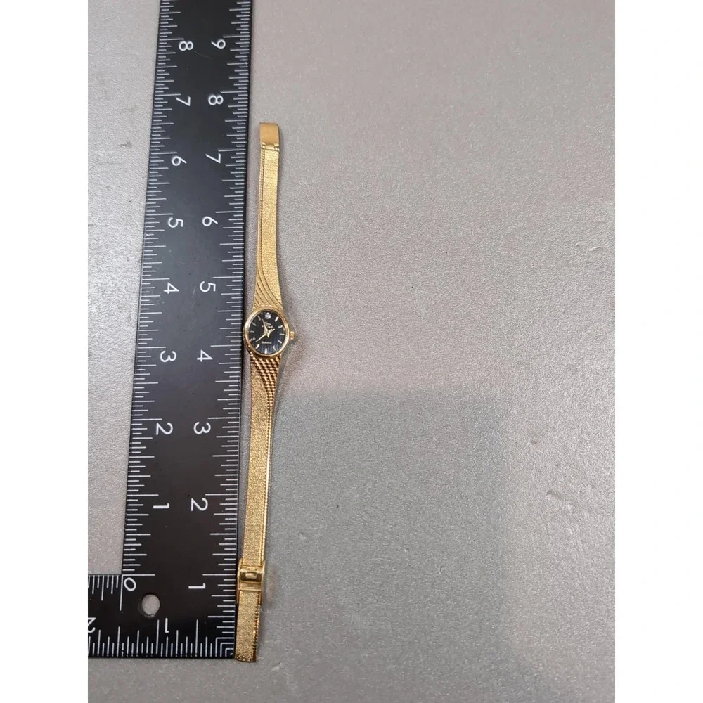 Oscar de la Renta Ladies Watch Gold Tone Textured Bracelet Black Dial 45-196